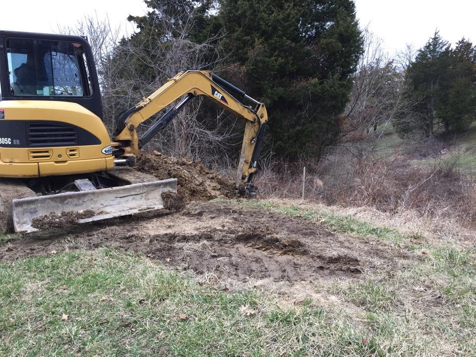 CAT mini excavator grading a rural lot in Northern Kentucky