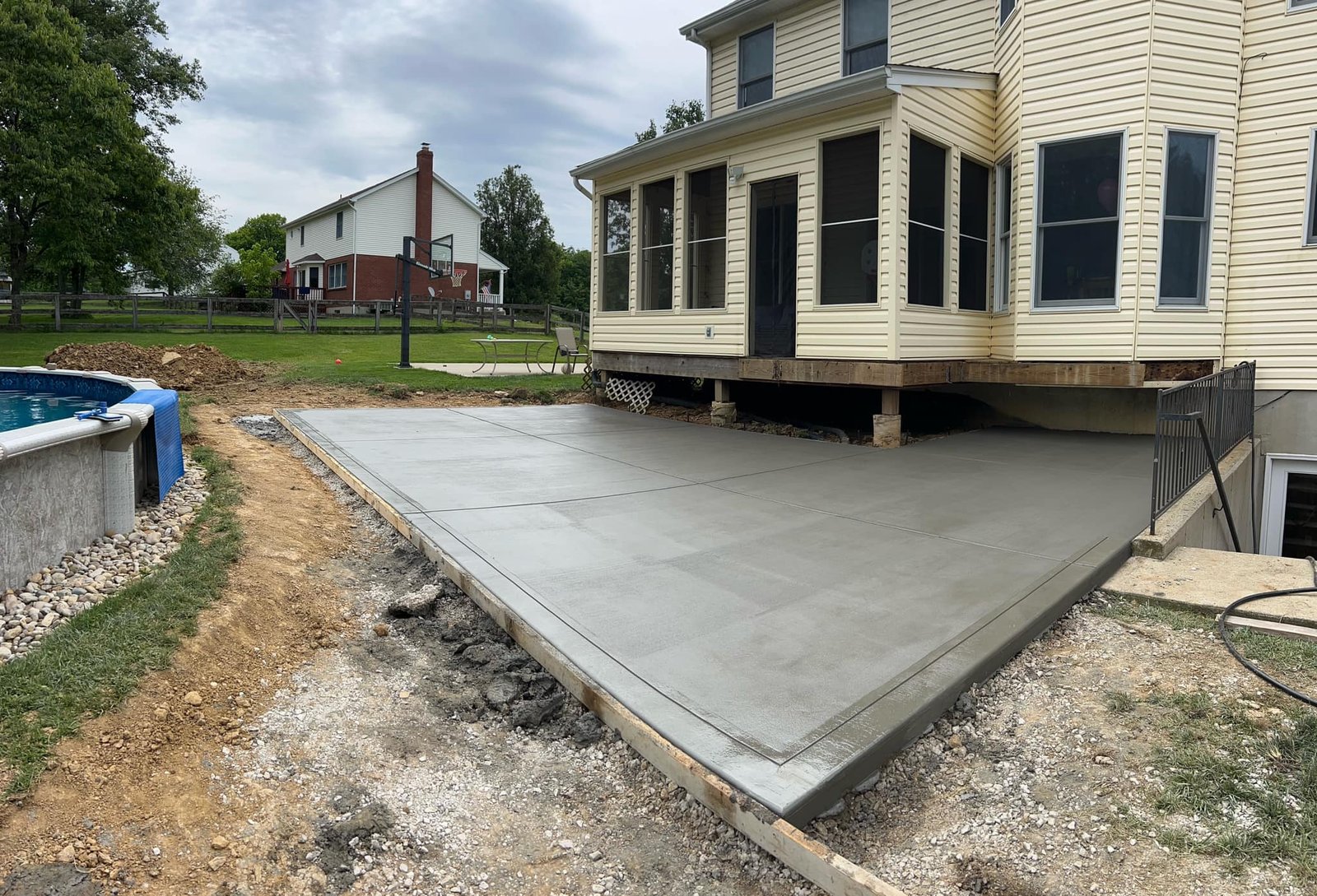 Broom-finish concrete pool deck in a rear yard in Northern Kentucky