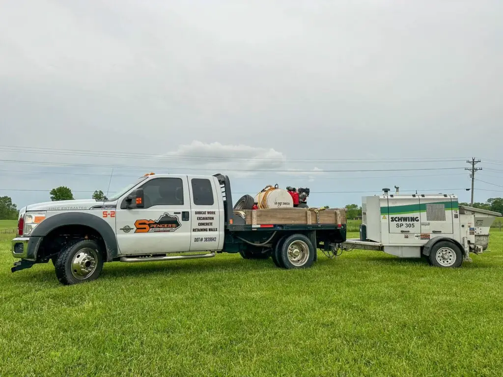 Spencer's Ford F-550 service truck towing Schwing SP 305 trailer-mounted concrete line pump