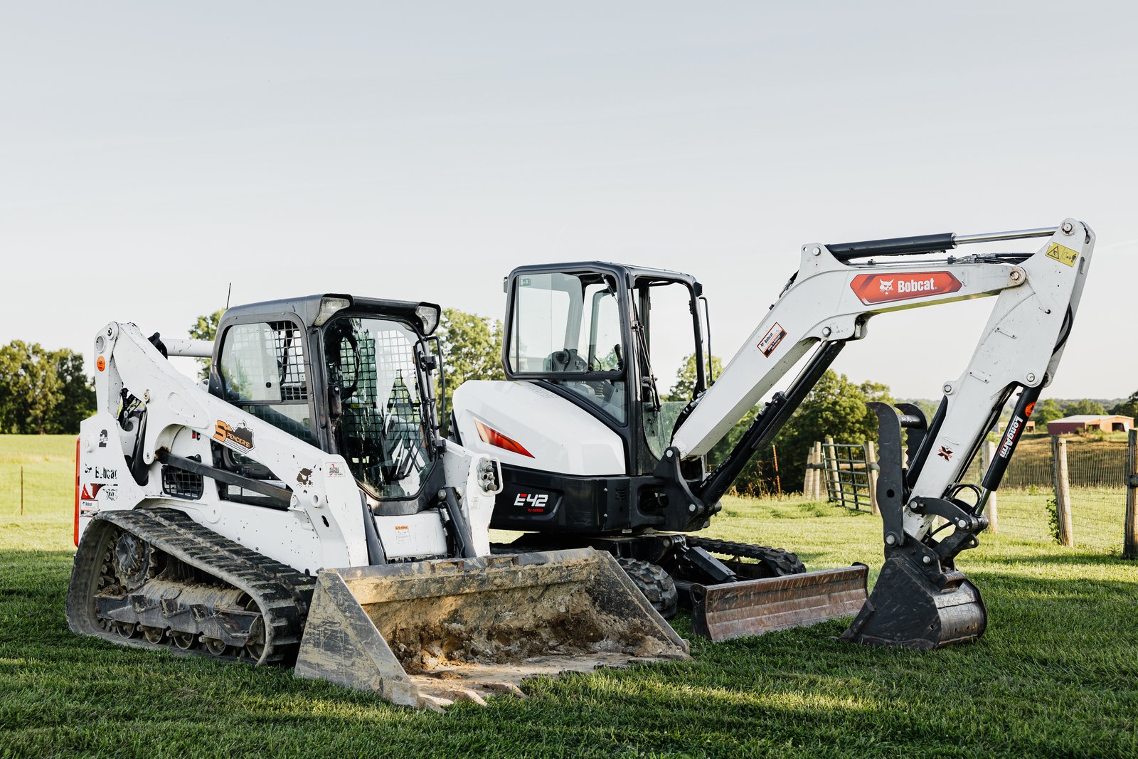 Spencer's Bobcat T66 skid steer and Bobcat E42 mini excavator side by side